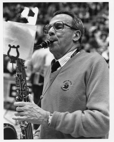 Black and white photograph of John Vincent Byrne playing the saxophone.
