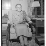 Grace French McCormick posing with a taxidermied owl_P082_02-2192.jpg